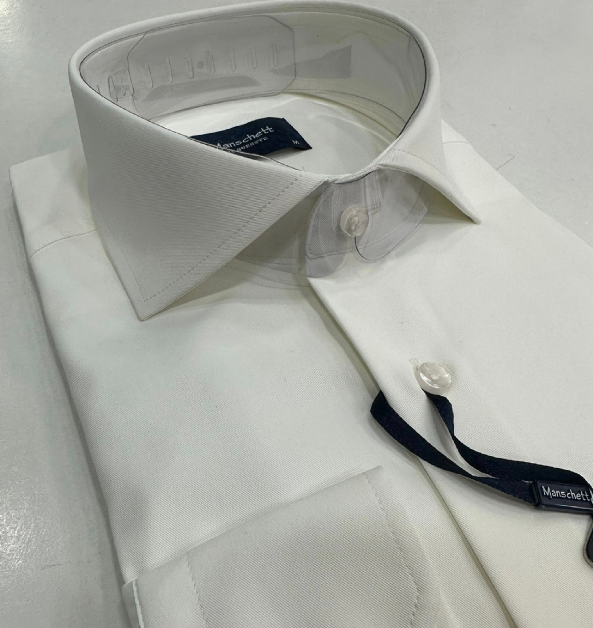White dress shirt with folded collar.